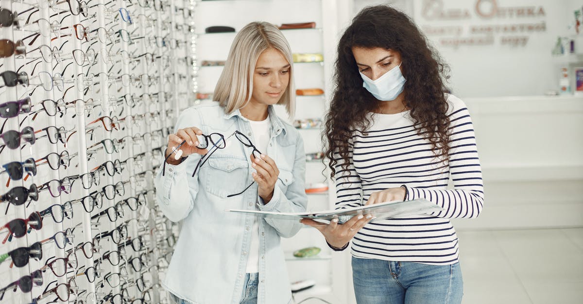 Bad tasting mussels and avoiding buying them - Woman Choosing Glasses at Optician Salon Bad tasting mussels and avoiding buying them - Woman Choosing Glasses at Optician Salon