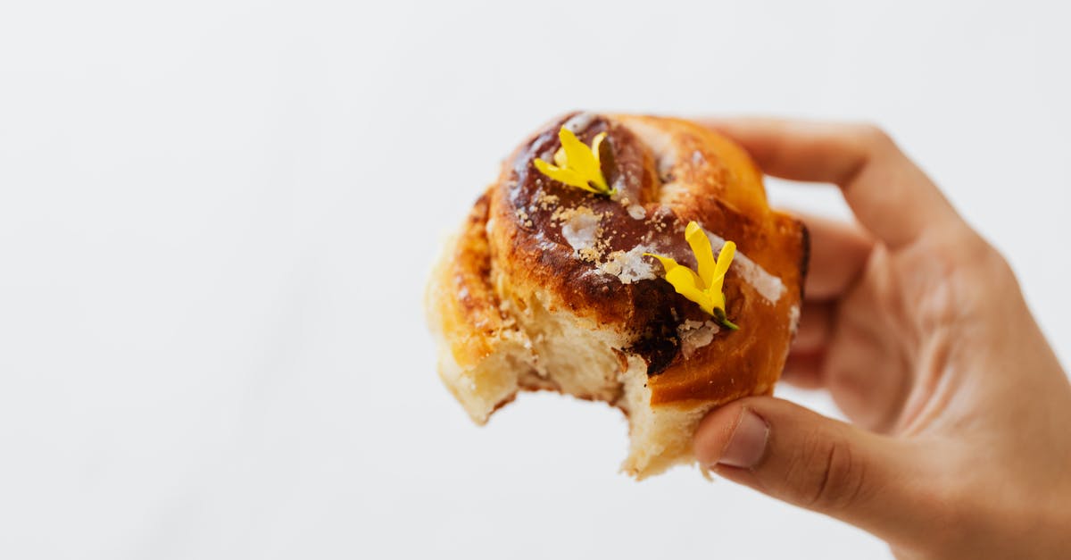Baked Raisin Cinnamon Bread and shipping - Cinnamon Bread With A Bite In Close-up View Baked Raisin Cinnamon Bread and shipping - Cinnamon Bread With A Bite In Close-up View