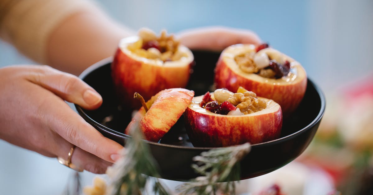 Baked Stuffing and cooking the turkey - Crop chef with tasty stuffed baked apples during Christmas holiday Baked Stuffing and cooking the turkey - Crop chef with tasty stuffed baked apples during Christmas holiday