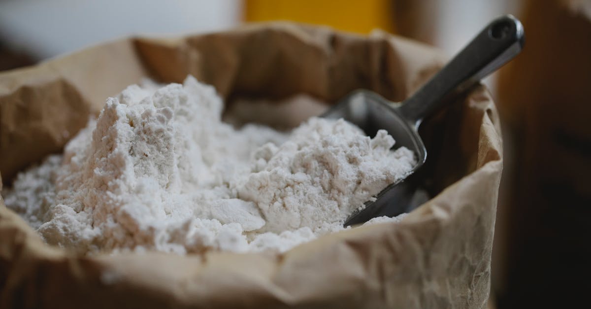 Baking a Pie in a Stainless Steel - Paper bag of wheat flour with stainless scoop Baking a Pie in a Stainless Steel - Paper bag of wheat flour with stainless scoop