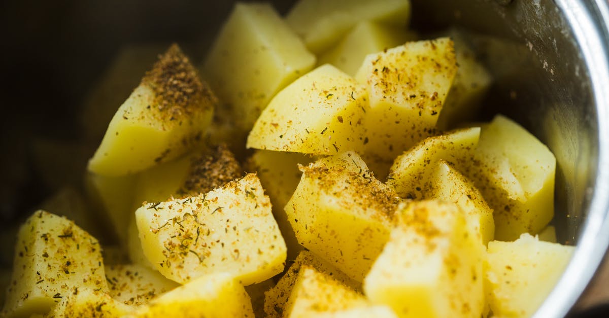 Baking cauliflower with potatoes - Slice Potatoes on a Cooking Pot Baking cauliflower with potatoes - Slice Potatoes on a Cooking Pot