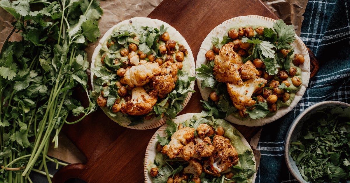 Baking cauliflower with potatoes - Overhead Shot of Baked Vegetables Baking cauliflower with potatoes - Overhead Shot of Baked Vegetables