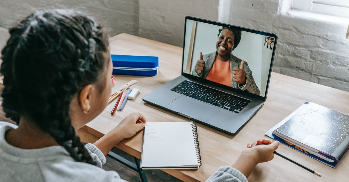 Baking course online - Ethnic girl having video chat with teacher online on laptop Baking course online - Ethnic girl having video chat with teacher online on laptop