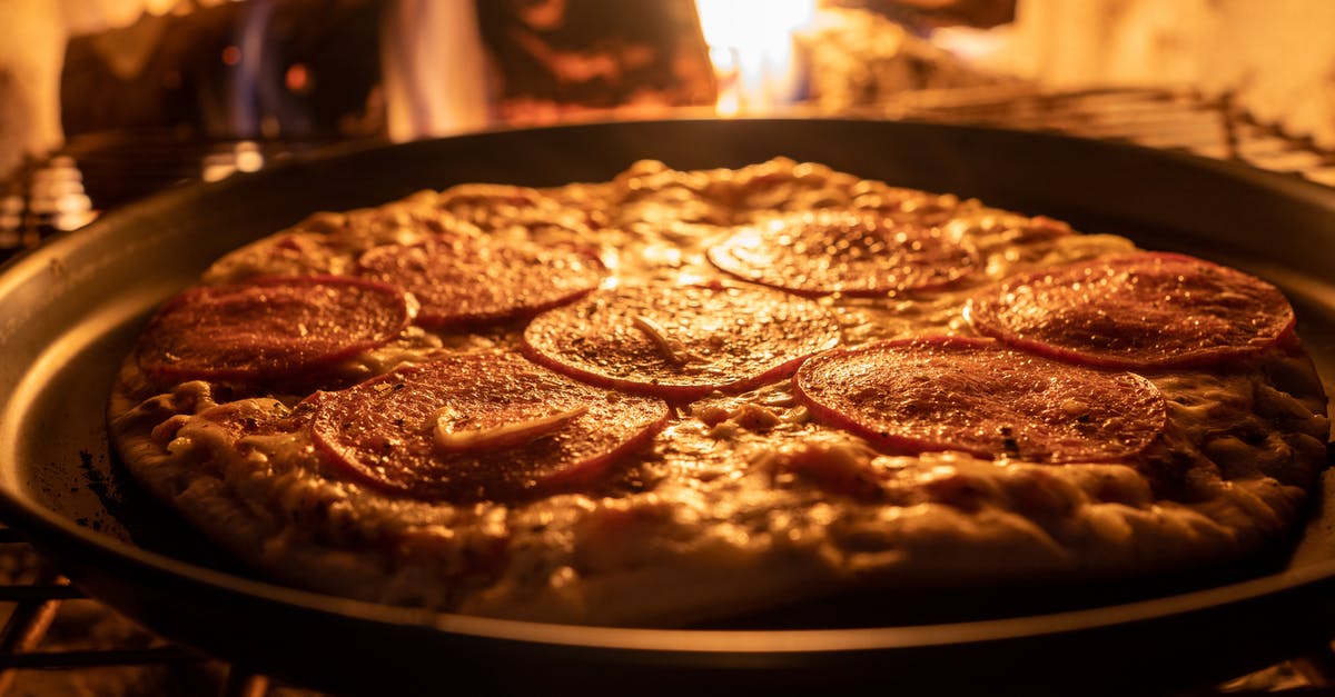 Baking pizza without an oven - Close-Up Shot of Pizza Getting Cooked Inside the Oven Baking pizza without an oven - Close-Up Shot of Pizza Getting Cooked Inside the Oven