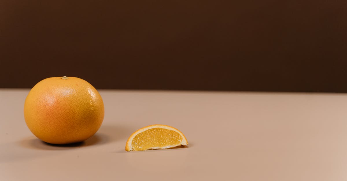 Balance out lemon juice in a smoothie, stinging my throat - Two Orange Fruits on White Table Balance out lemon juice in a smoothie, stinging my throat - Two Orange Fruits on White Table