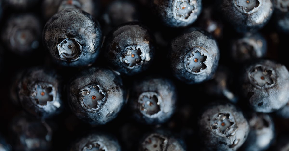 Bananas are radioactive...so how many exactly would you have eat to die? Is it possible to calculate? [closed] - Closeup bunch of fresh delicious and sweet blueberries placed on counter of supermarket