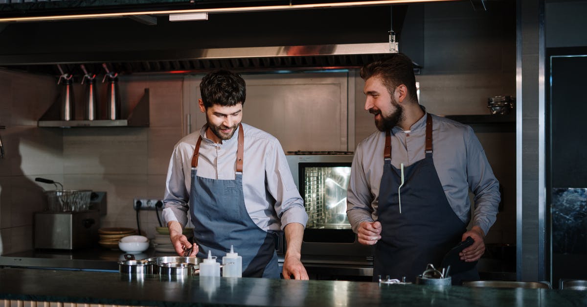 Basque cod with sous-vide - Man in Black Vest and White Dress Shirt Standing Beside Man in Black Vest