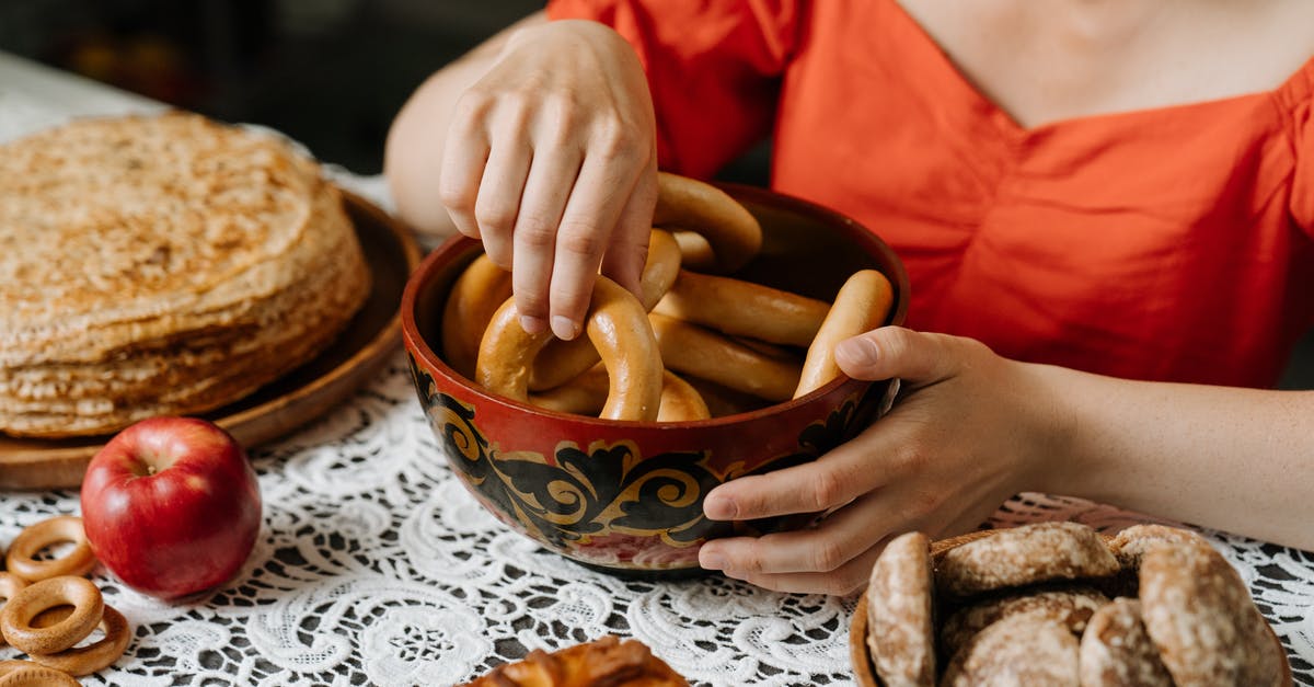 BBQ-style baked beans without mustard? - Person in Red Long Sleeve Shirt Holding Brown Wooden Round Bowl BBQ-style baked beans without mustard? - Person in Red Long Sleeve Shirt Holding Brown Wooden Round Bowl