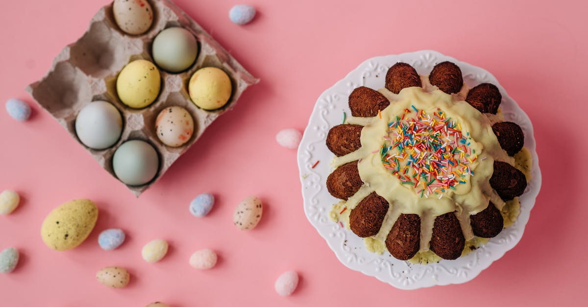 Beating eggs for brownie - White and Brown Cake With White Icing on Pink Table