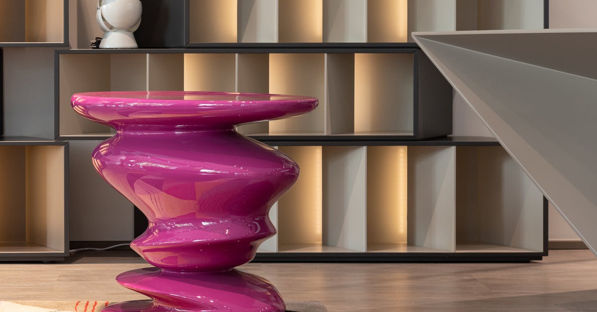 Beef: Red on the outside, brown on the inside - Creative table and shelves with souvenir in modern room Beef: Red on the outside, brown on the inside - Creative table and shelves with souvenir in modern room