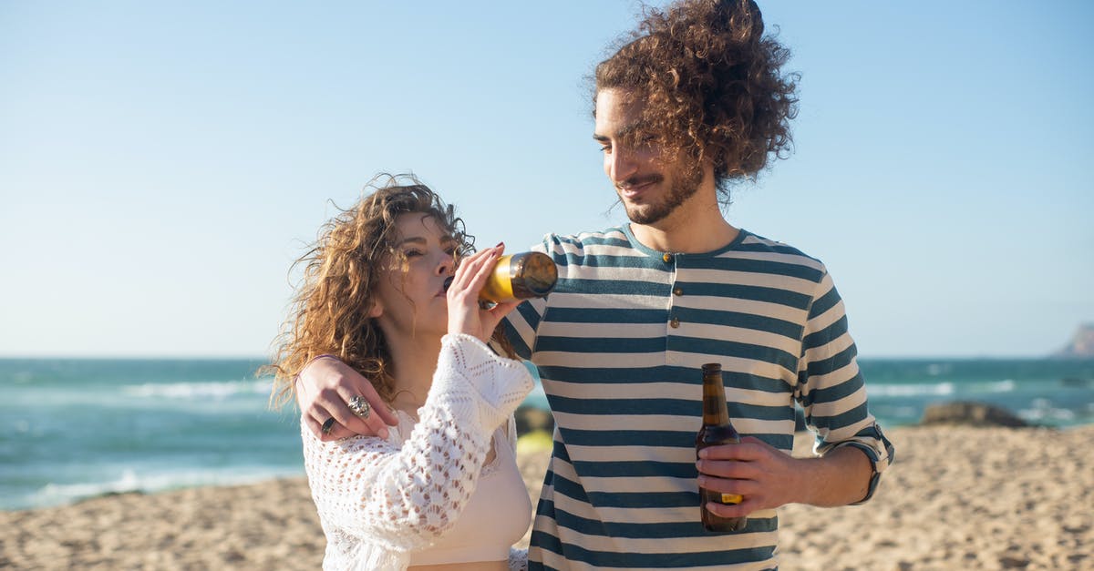 Beer Battered Onion Rings -- what makes them look shiny? - Couple Drinking Beer on Beach Beer Battered Onion Rings -- what makes them look shiny? - Couple Drinking Beer on Beach