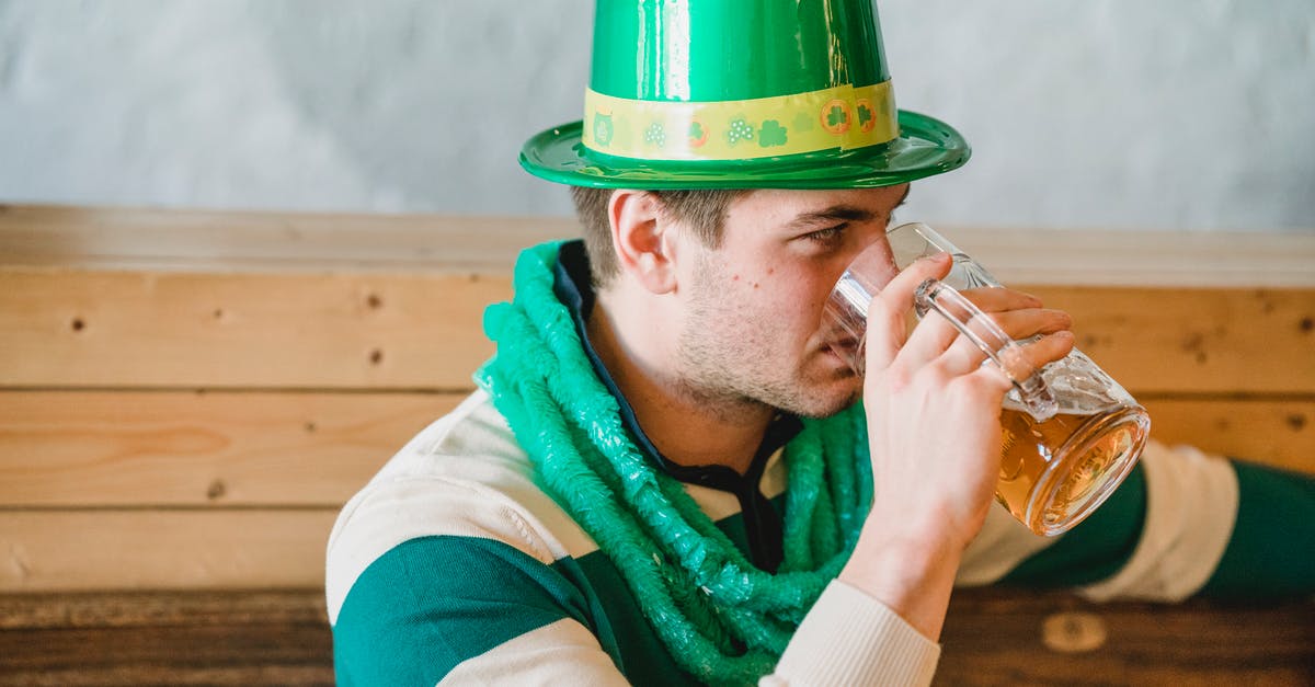 Beer Battered Onion Rings -- what makes them look shiny? - Man drinking beer during Feast of Saint Patrick Beer Battered Onion Rings -- what makes them look shiny? - Man drinking beer during Feast of Saint Patrick