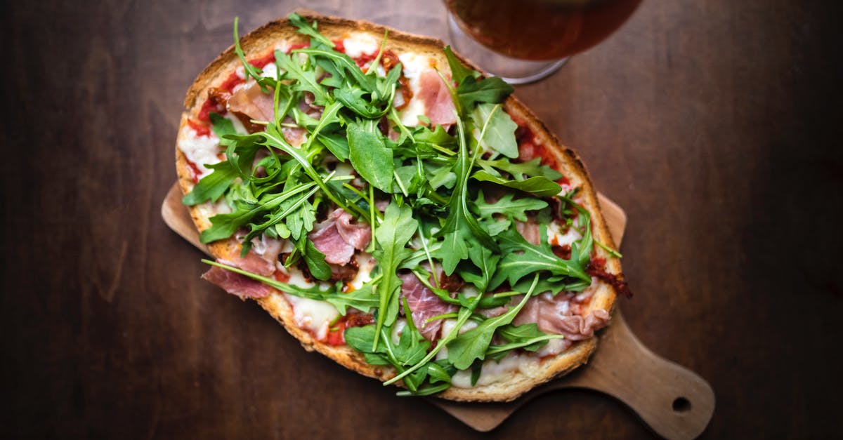 Beer in Sourdough Starter - From above of tasty toast with cured meat slices and melted cheese with fresh herb leaves on brown background Beer in Sourdough Starter - From above of tasty toast with cured meat slices and melted cheese with fresh herb leaves on brown background