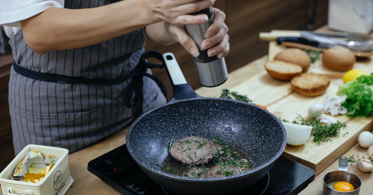 Best beef joint for slow cooker - Unrecognizable female cook wearing apron adding seasoning on cutlets while preparing delicious burger at table with stove in kitchen Best beef joint for slow cooker - Unrecognizable female cook wearing apron adding seasoning on cutlets while preparing delicious burger at table with stove in kitchen