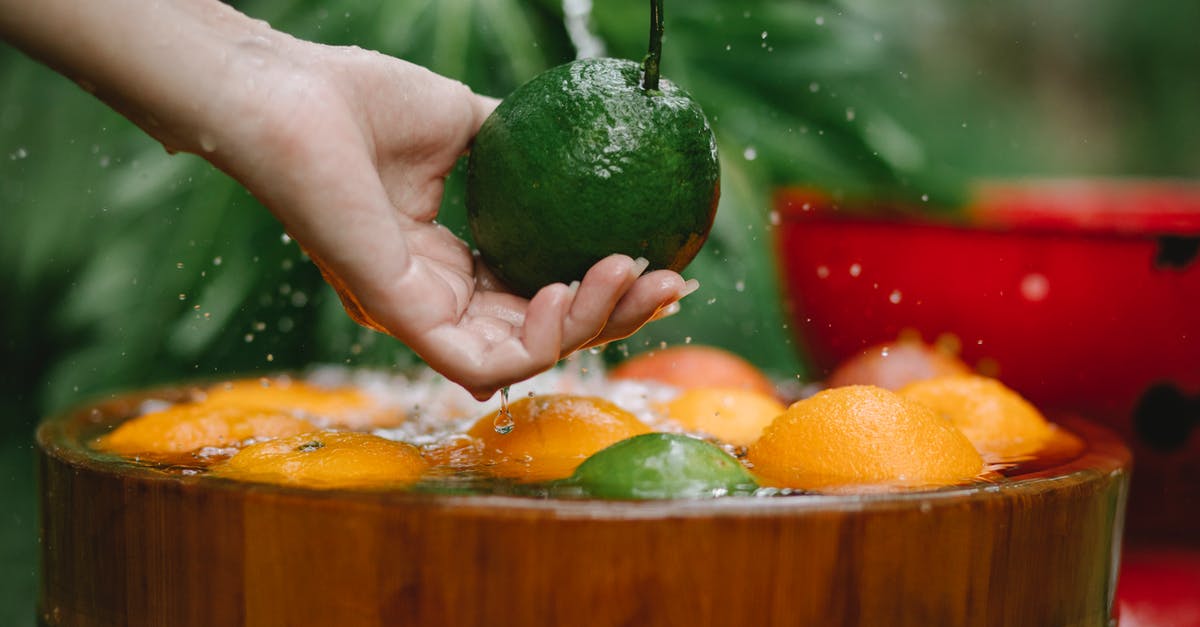 Best vegan substitute for egg wash - Crop woman washing fresh fruits in bowl Best vegan substitute for egg wash - Crop woman washing fresh fruits in bowl