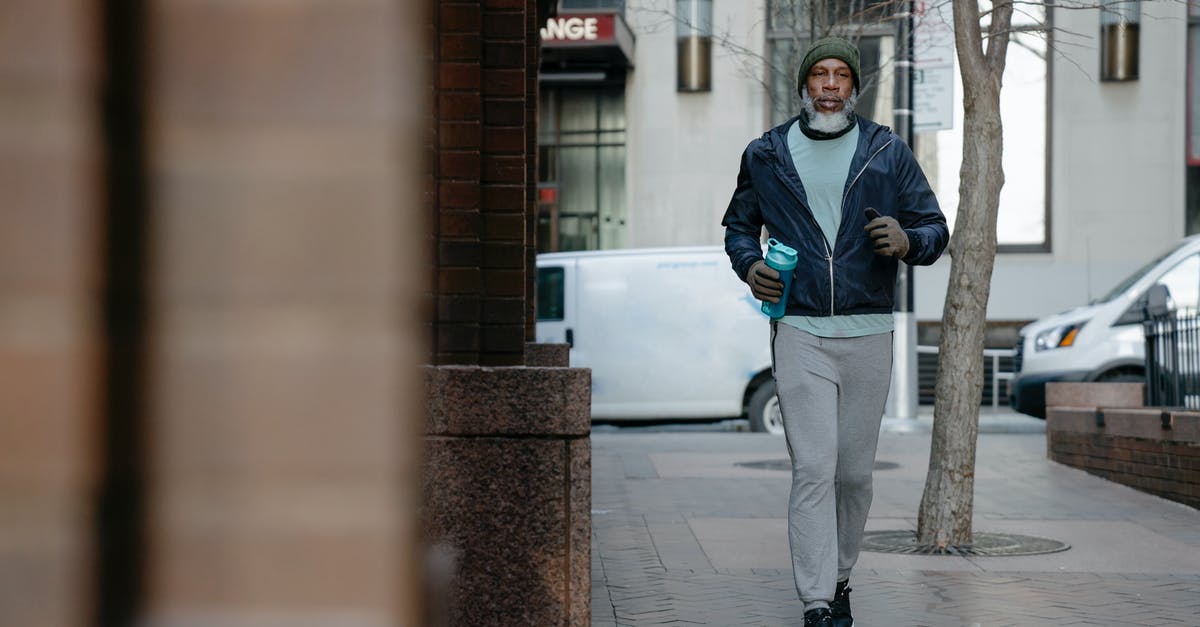 Best way to bottle peri peri sauce? - Serious African American male jogging on pavement in city Best way to bottle peri peri sauce? - Serious African American male jogging on pavement in city