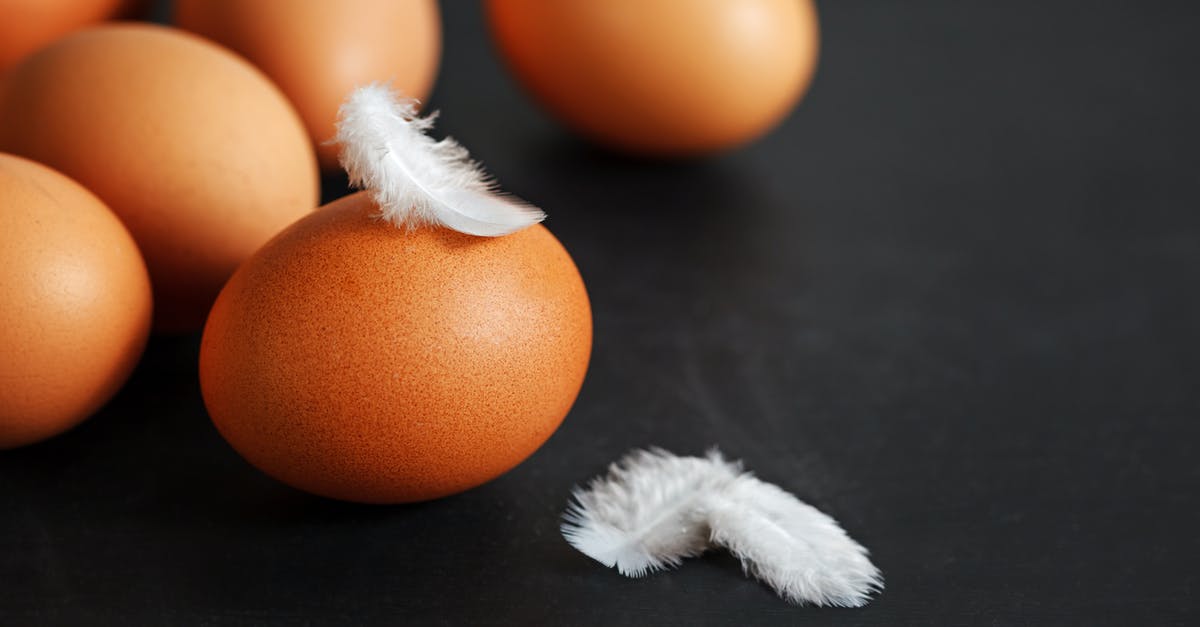 Best way to cook a two bird roast? - Chicken eggs placed on black table