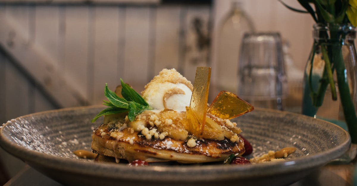 Best way to impart rum flavor in caramel candies? - Delicious pancaked with caramel and syrup served on plate with ice cream scoop and decorated with fresh mint leaves in cafe Best way to impart rum flavor in caramel candies? - Delicious pancaked with caramel and syrup served on plate with ice cream scoop and decorated with fresh mint leaves in cafe