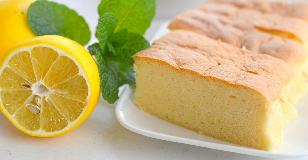 Biga Bread sponge - Close-Up View of Sliced Sponge Cake on a Plate beside a Lemon Biga Bread sponge - Close-Up View of Sliced Sponge Cake on a Plate beside a Lemon