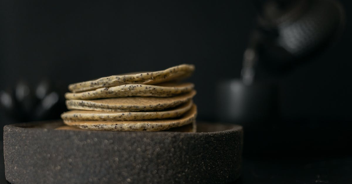 black residue in tea kettle - Tasty pancakes on table with teapot black residue in tea kettle - Tasty pancakes on table with teapot