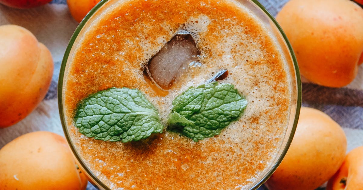 Blending a smoothie without changing the taste - Glass of fresh cocktail with apricots Blending a smoothie without changing the taste - Glass of fresh cocktail with apricots