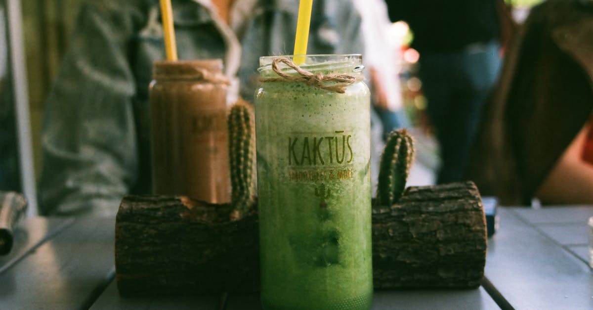 Blending a smoothie without changing the taste - Green Beverage With Straw Blending a smoothie without changing the taste - Green Beverage With Straw