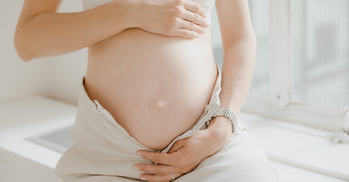 Boiling potatoes with vs. without skin - A Pregnant Woman in White Top and White Pants Boiling potatoes with vs. without skin - A Pregnant Woman in White Top and White Pants