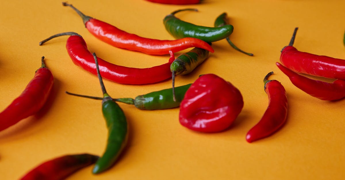 Books for very high level vegan cooking? - Red and green chili peppers scattered on yellow surface