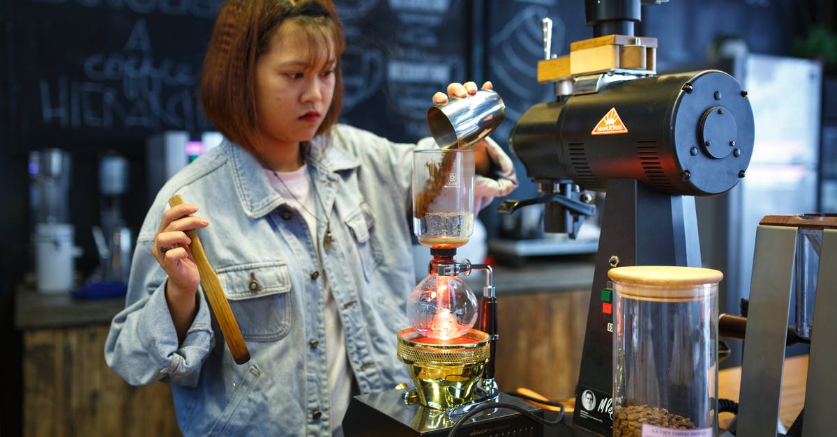 Bottling and Storing Cold-Brewed Coffee? - Woman Mixing Beverages Bottling and Storing Cold-Brewed Coffee? - Woman Mixing Beverages