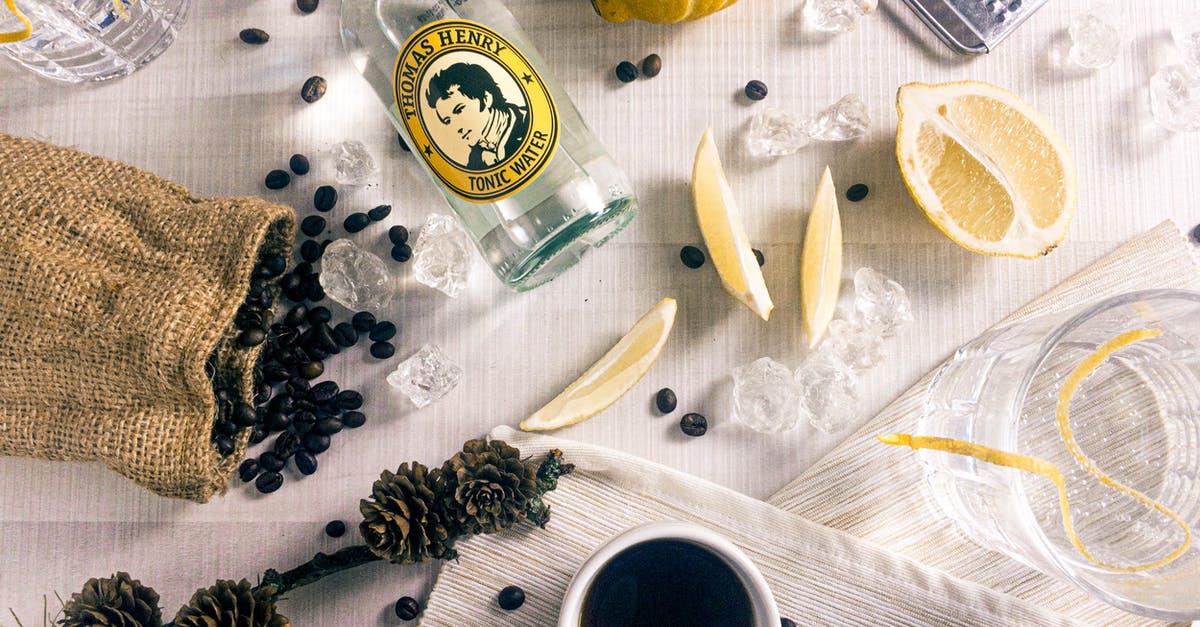 Bottling and Storing Cold-Brewed Coffee? - Beans and Sliced Lemon Near Glass Bottle Bottling and Storing Cold-Brewed Coffee? - Beans and Sliced Lemon Near Glass Bottle