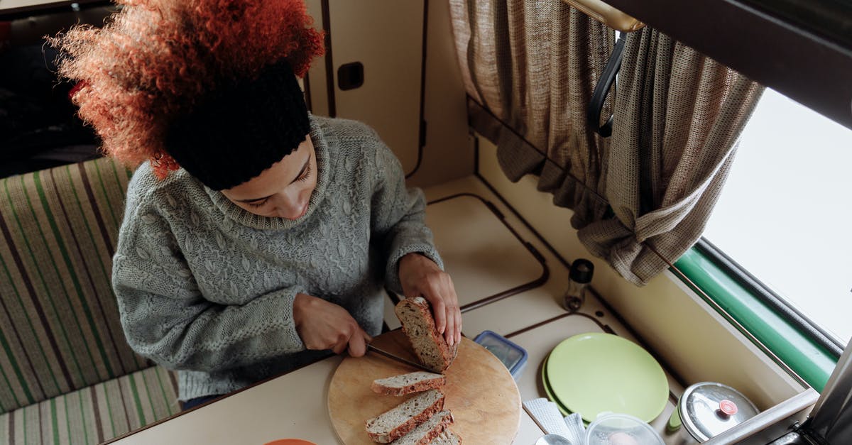 Bread is not rising - Woman in Gray Sweater Eating Bread Bread is not rising - Woman in Gray Sweater Eating Bread