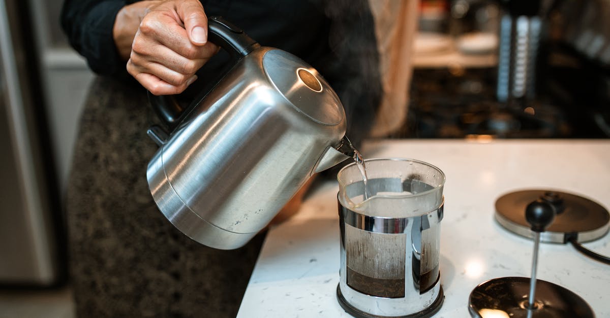 Brewing Hibiscus tea - A Person Brewing Tea