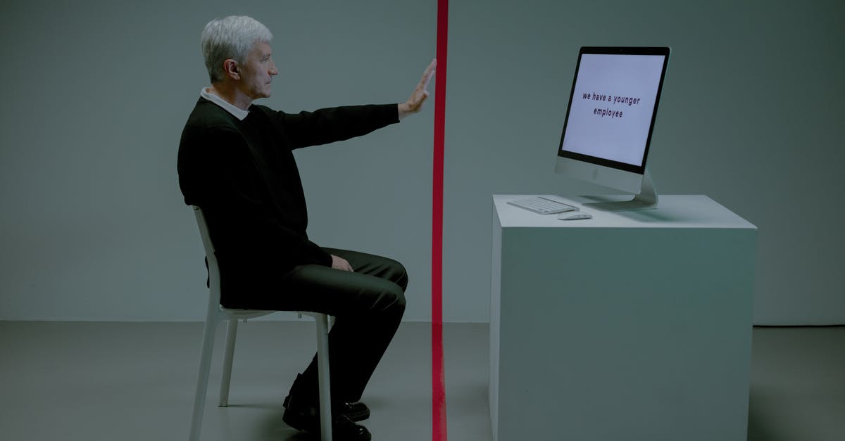 Brining before dehydrating? - Senior adult man sitting before computer separated from him by red line Brining before dehydrating? - Senior adult man sitting before computer separated from him by red line