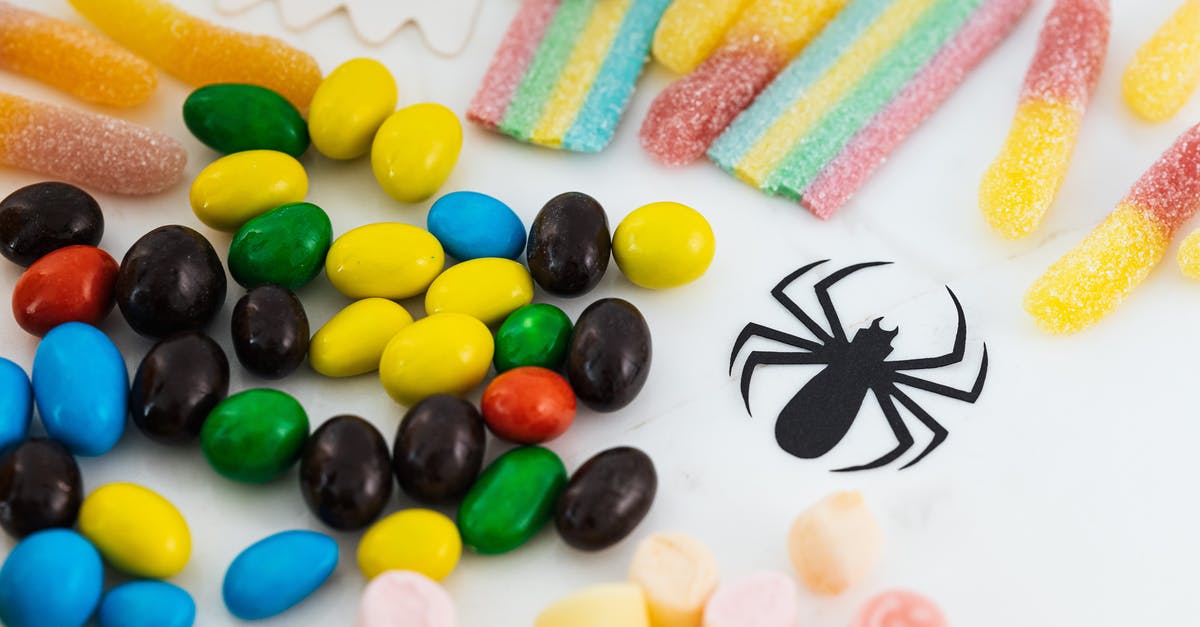 brittle layered nut candies - Assorted Color Candies on White Surface brittle layered nut candies - Assorted Color Candies on White Surface