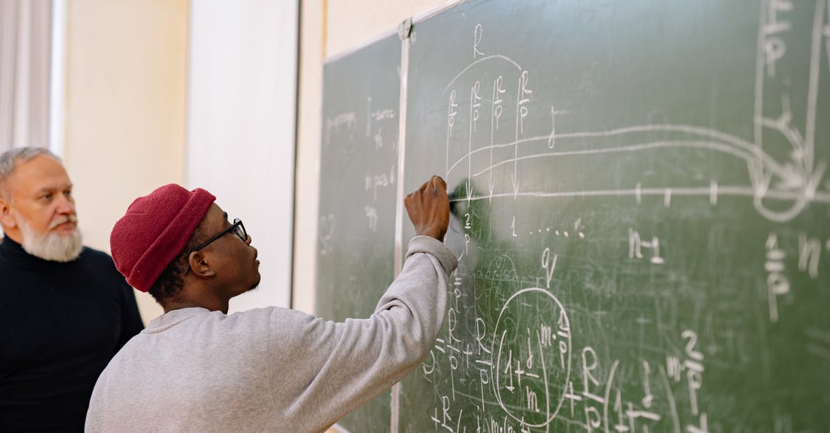 Brownie Questions - Man in White Long Sleeve Shirt Writing on Chalk Board Brownie Questions - Man in White Long Sleeve Shirt Writing on Chalk Board