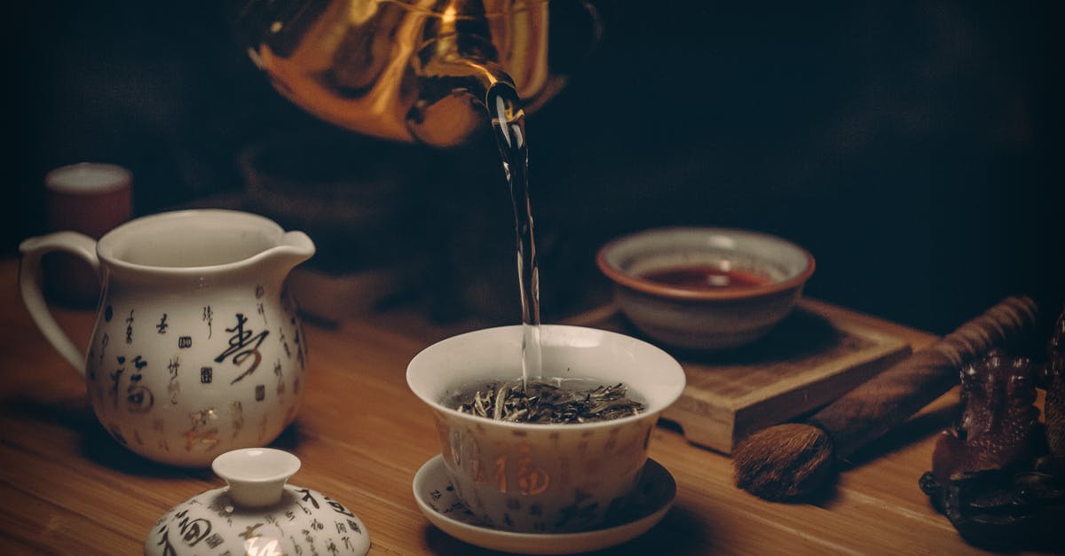 Bubble Tea - Instant or Traditional Pearls - Gold Kettle Pouring Hot Water on Cup of Tea Bubble Tea - Instant or Traditional Pearls - Gold Kettle Pouring Hot Water on Cup of Tea