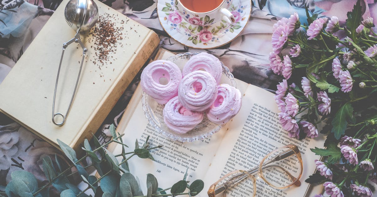Bubble Tea - Instant or Traditional Pearls - Floral Ceramic Cup and Saucer Above Open Book Bubble Tea - Instant or Traditional Pearls - Floral Ceramic Cup and Saucer Above Open Book