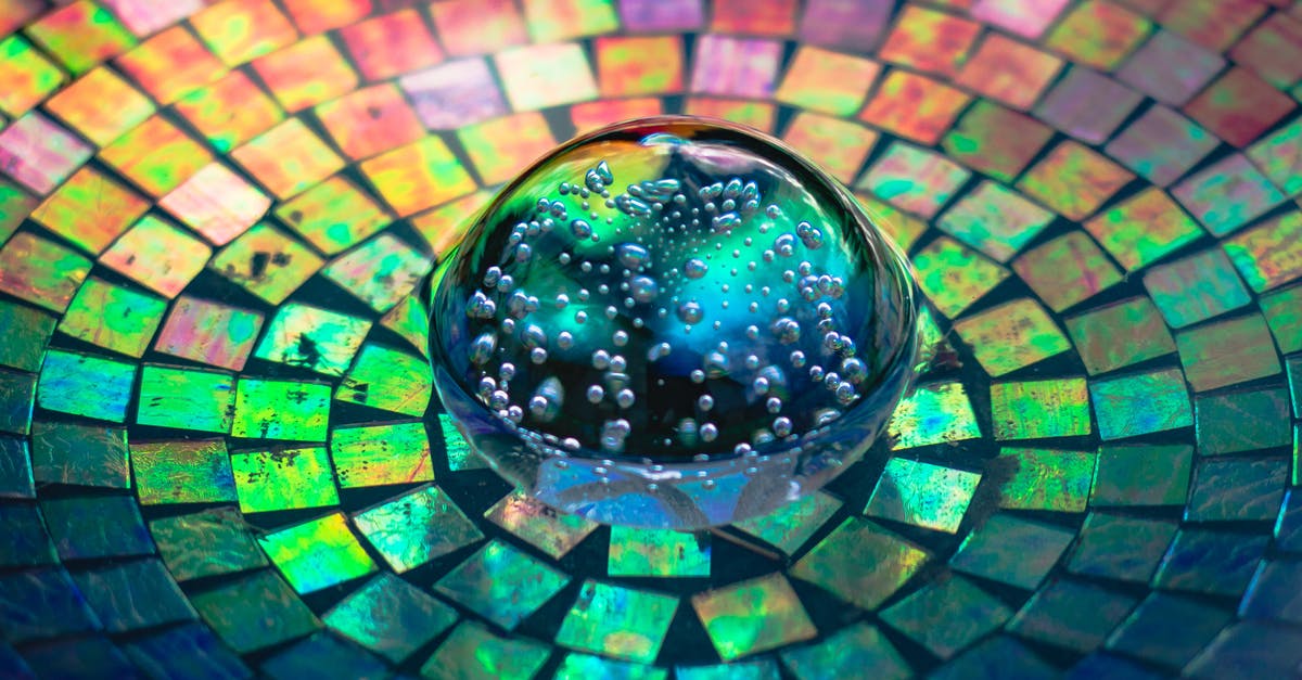 Bubbles in unopened store bought items? - Crystal Glass On A Colorful Background Bubbles in unopened store bought items? - Crystal Glass On A Colorful Background