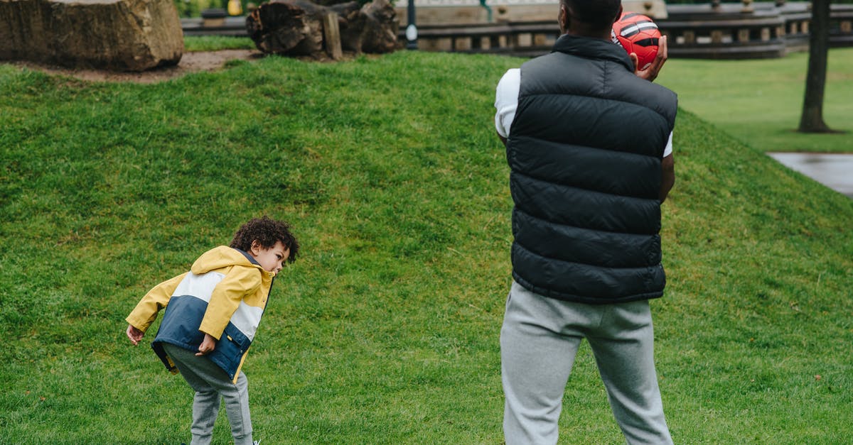 Buckwheat groats have grassy smell? - Unrecognizable black father playing with kid Buckwheat groats have grassy smell? - Unrecognizable black father playing with kid