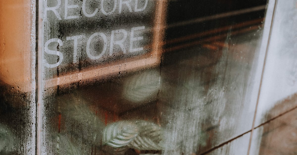 Burned water out of pot...popping sound a month later? - High angle of transparent glass wall with wet surface covered with water drops of record store Burned water out of pot...popping sound a month later? - High angle of transparent glass wall with wet surface covered with water drops of record store