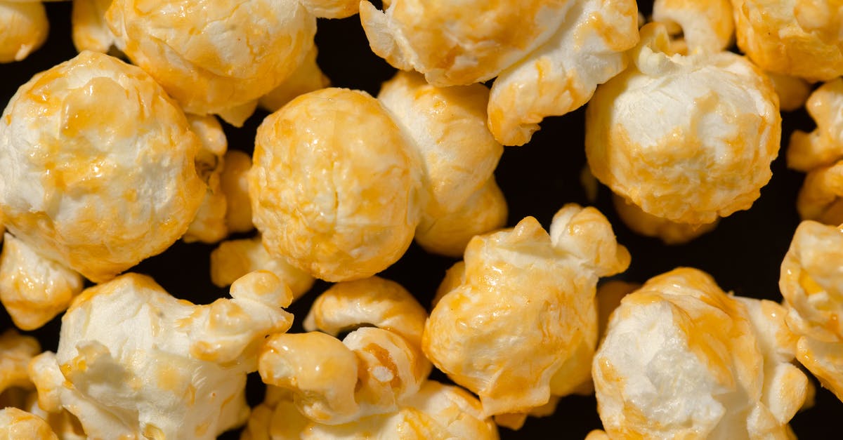Butter and Butter Flavored Shortening - Popcorns in Close-up Shot Butter and Butter Flavored Shortening - Popcorns in Close-up Shot