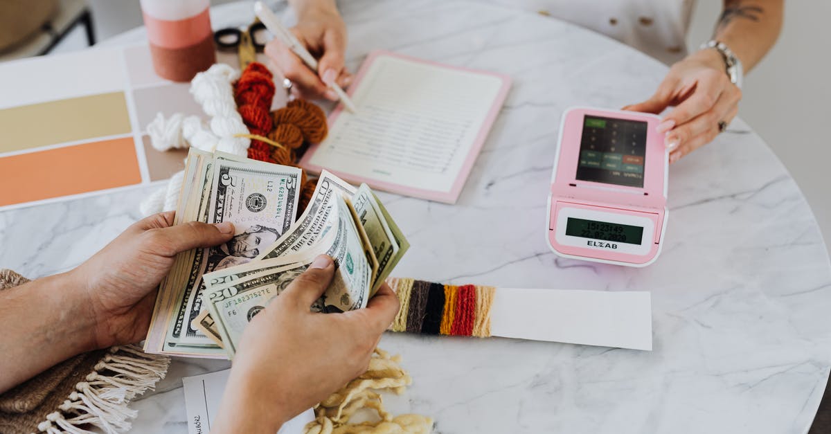 Buying European flours in the United States? - Hands Holding US Dollar Bills Buying European flours in the United States? - Hands Holding US Dollar Bills