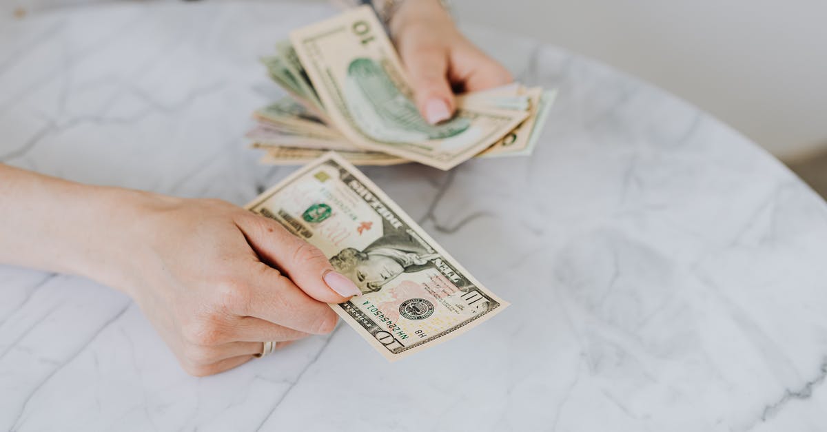 Buying European flours in the United States? - Person Holding US Dollar Bills Buying European flours in the United States? - Person Holding US Dollar Bills
