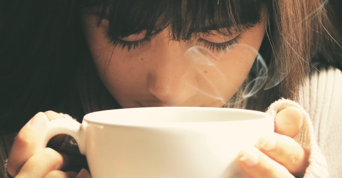 Caffeine pills don't dissolve in hot tea - Woman Holding White Cup Caffeine pills don't dissolve in hot tea - Woman Holding White Cup