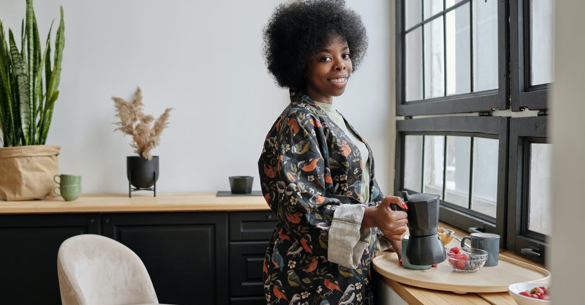 Caffettiera (Moka Pot) is not making coffee properly - Happy Woman Having Breakfast Caffettiera (Moka Pot) is not making coffee properly - Happy Woman Having Breakfast