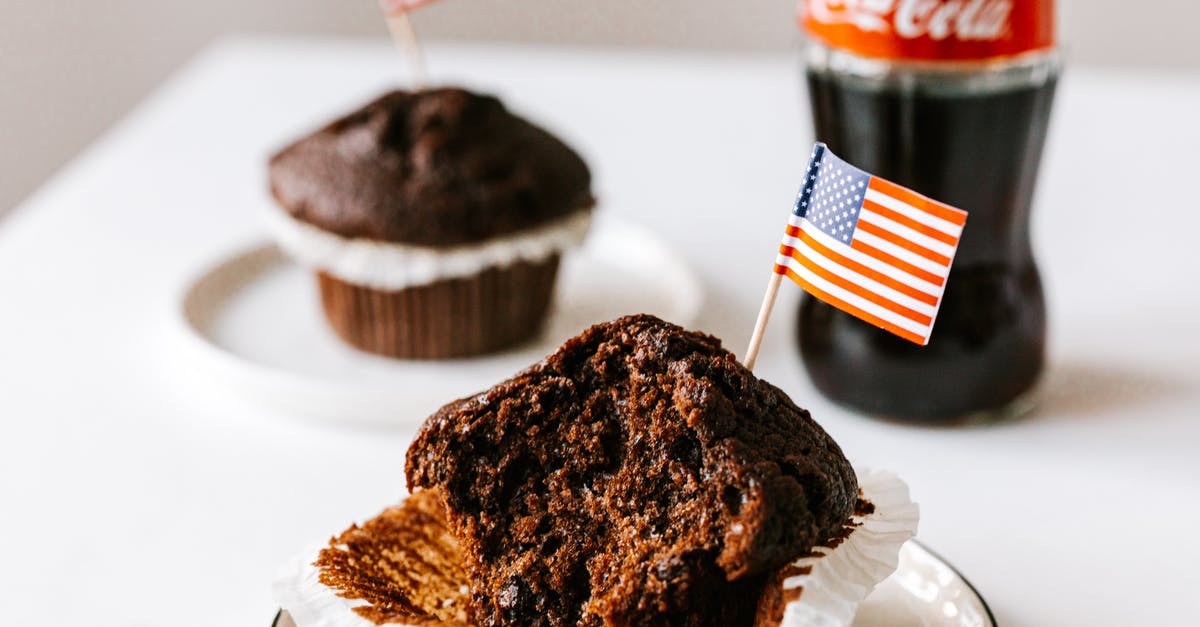 Cake without baking soda - Sweet cakes with toothpick american flags placed on table with soda bottle Cake without baking soda - Sweet cakes with toothpick american flags placed on table with soda bottle
