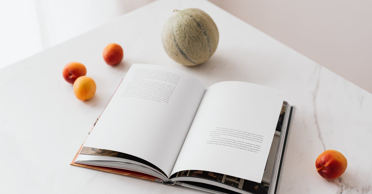 Calculating Nutrition Information for Commercial Food Labeling - Fresh fruits scattered on table near opened textbook Calculating Nutrition Information for Commercial Food Labeling - Fresh fruits scattered on table near opened textbook