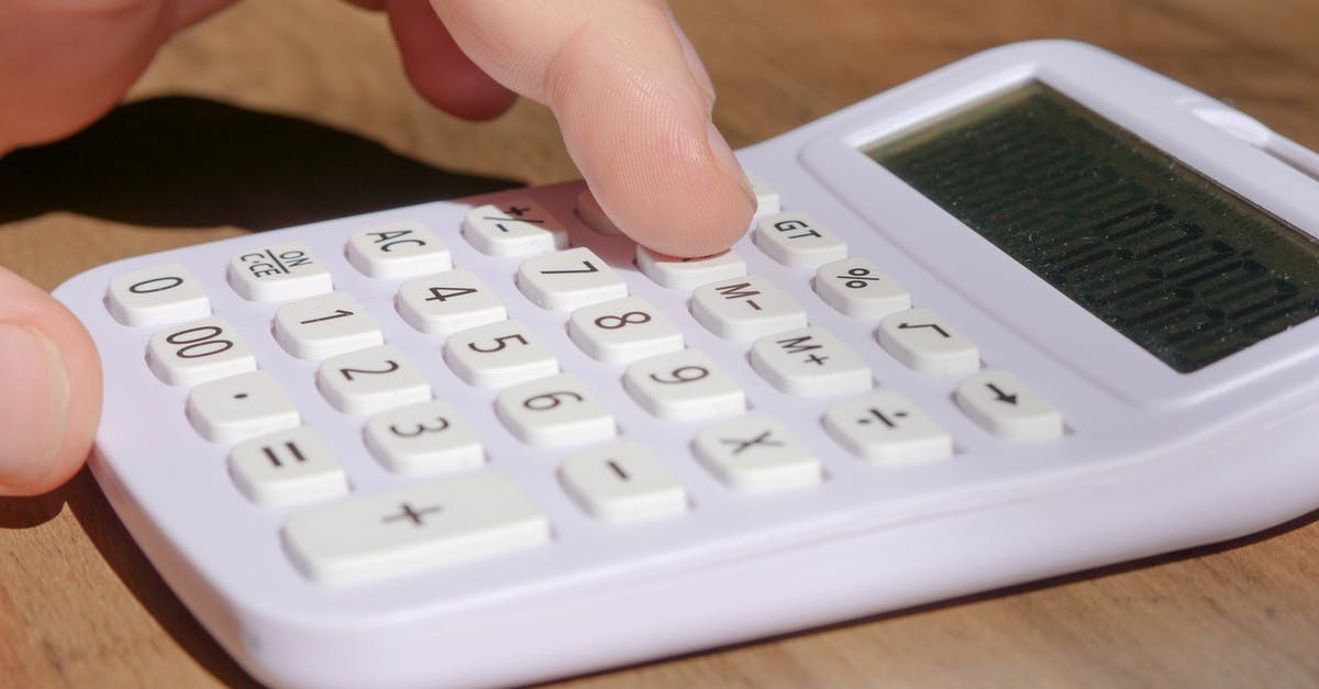Calculating Salt/Sugar additions for Mushroom based Jerky - Person Using a Calculator Calculating Salt/Sugar additions for Mushroom based Jerky - Person Using a Calculator