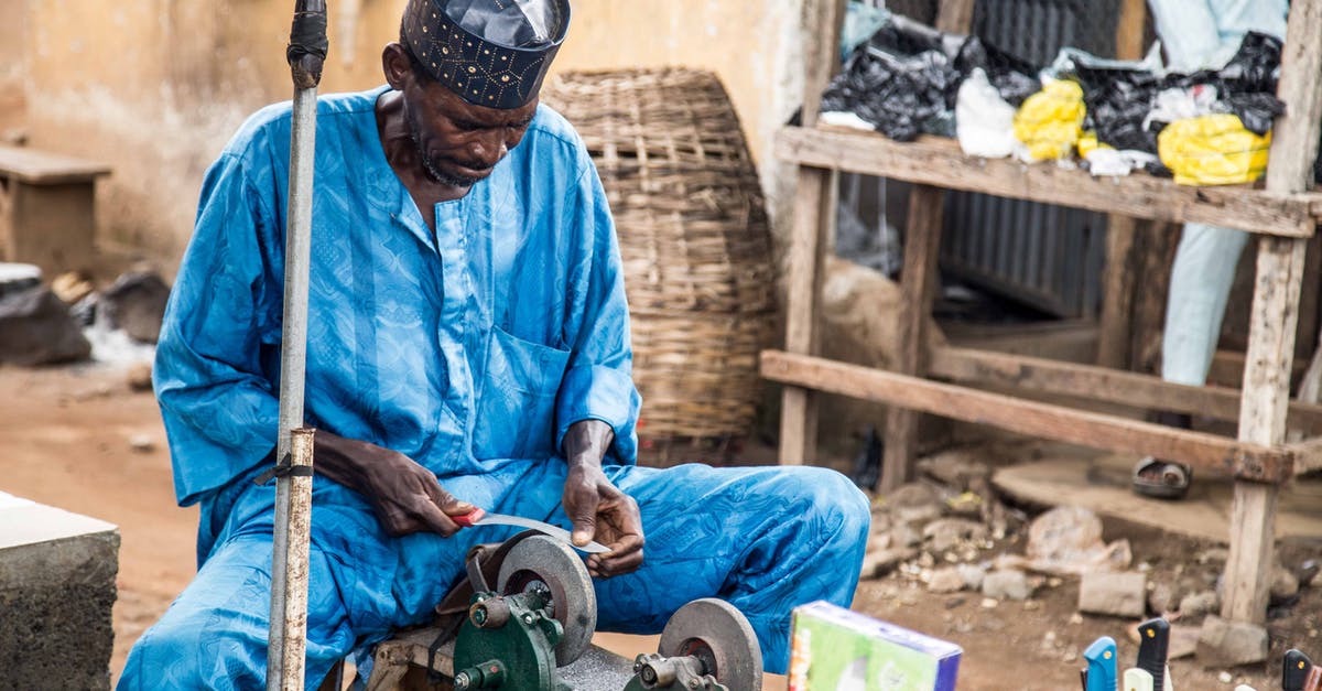 Can a blunt knife be sharpened? - Man in Blue Dress Shirt and Blue Denim Jeans Sitting on Brown Wooden Chair Can a blunt knife be sharpened? - Man in Blue Dress Shirt and Blue Denim Jeans Sitting on Brown Wooden Chair