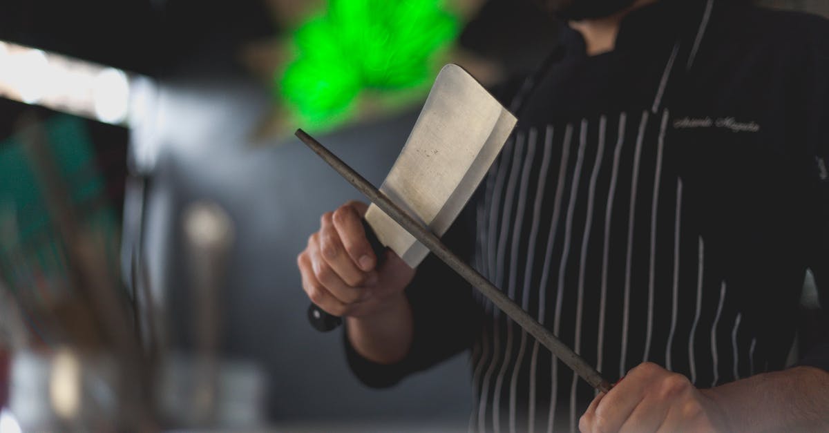 Can a blunt knife be sharpened? - Man Wearing an Apron Sharpening a Knife Can a blunt knife be sharpened? - Man Wearing an Apron Sharpening a Knife